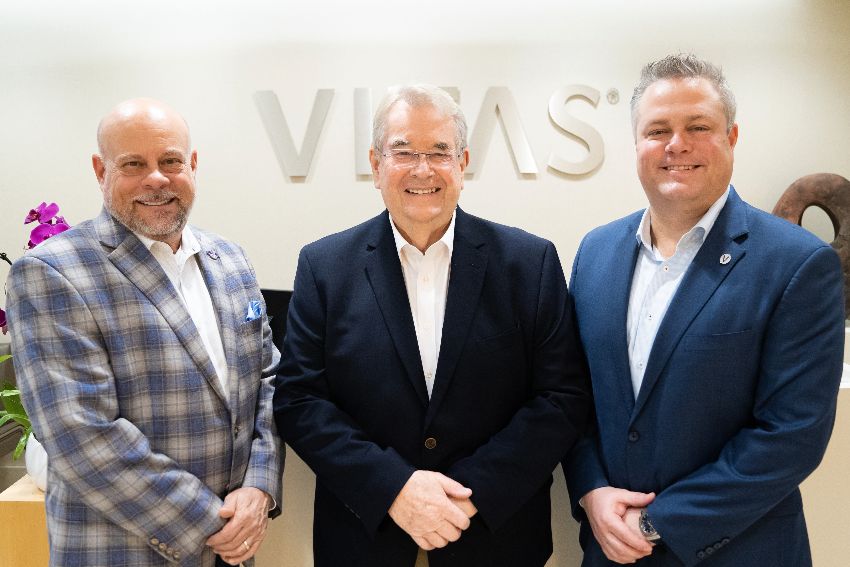 The three men together in a VITAS meeting room