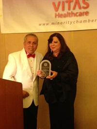 Doug Mayorga presents an award to Maria Hidalgo Diaz