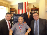 Michael Tancreda displays his service medal