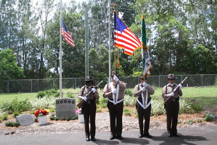 Four Color Guard members at attention