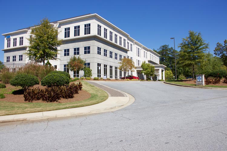 Looking up the driveway at the building's exterior