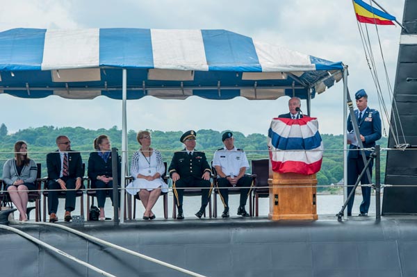 Rep. Joe Courtney speaks from a podium on the USS Nautilus