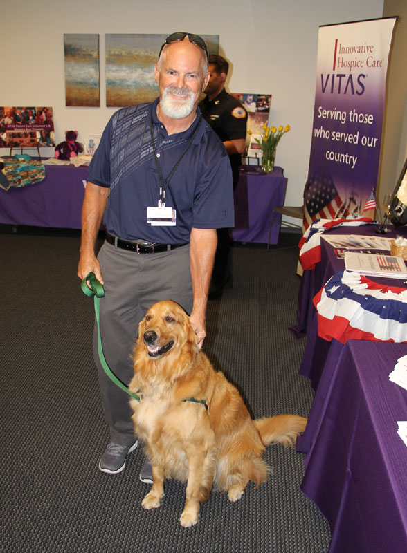 A Paw Pals volunteer dog and his owner