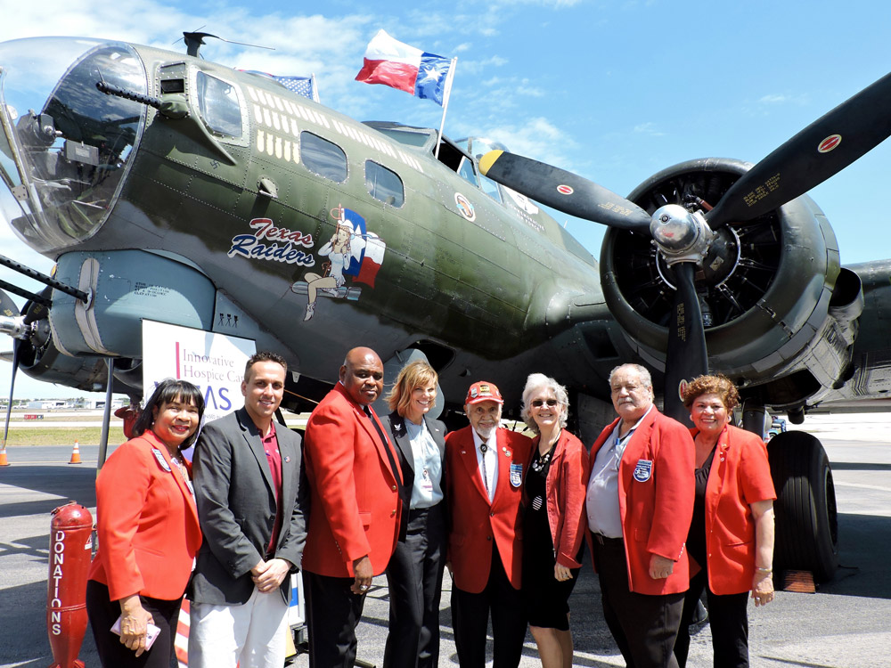 The group stands in front of the Texas Raiders  Boeing B-17 Flying Fortress