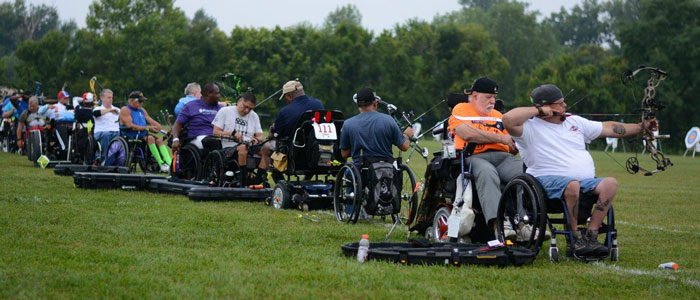 Veterans take aim at the archery targets with compound bows