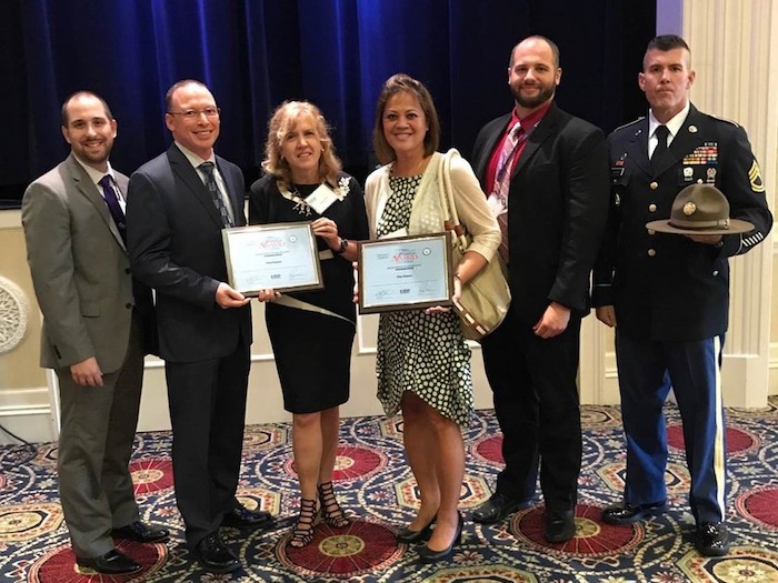 The group poses with the nomination