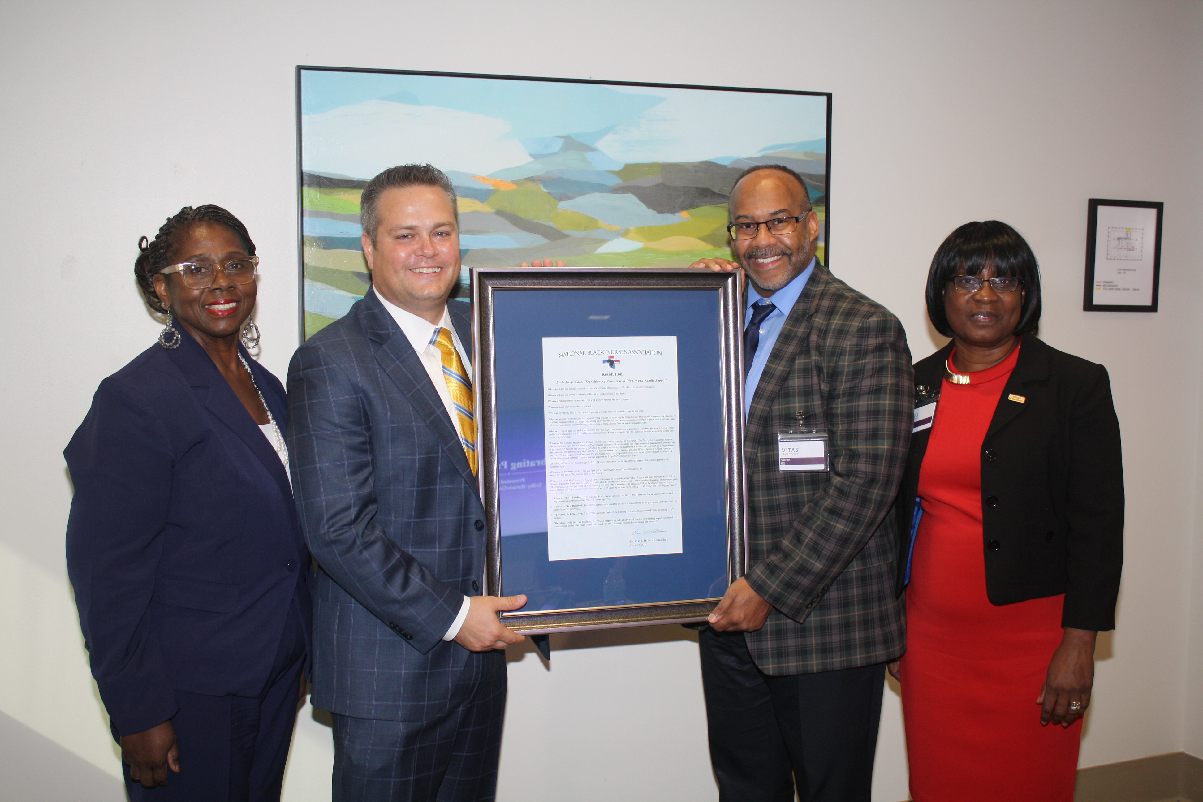 Westfall and Fields hold up the framed proclamation