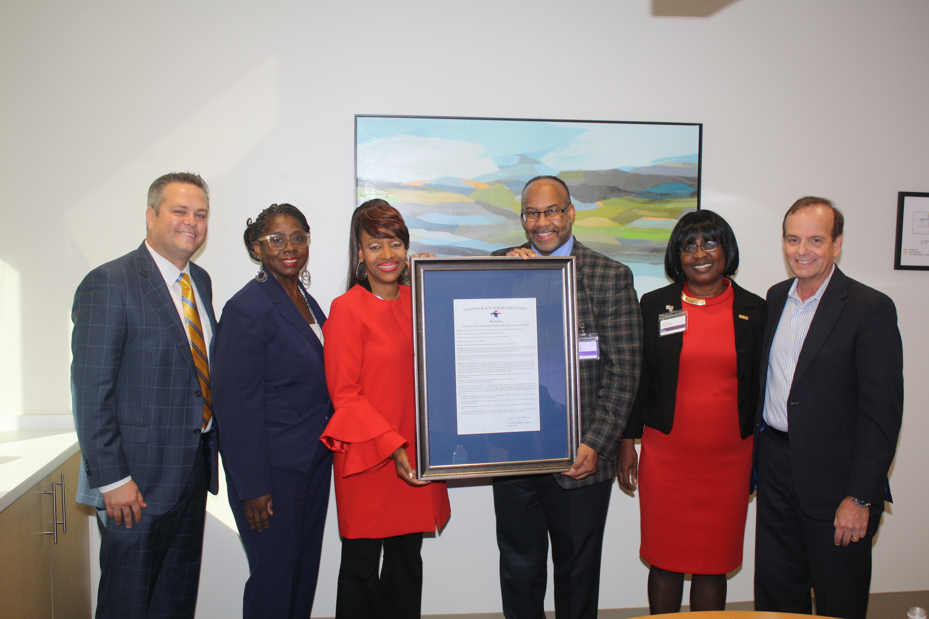 Deese and Fields hold up the framed proclamation