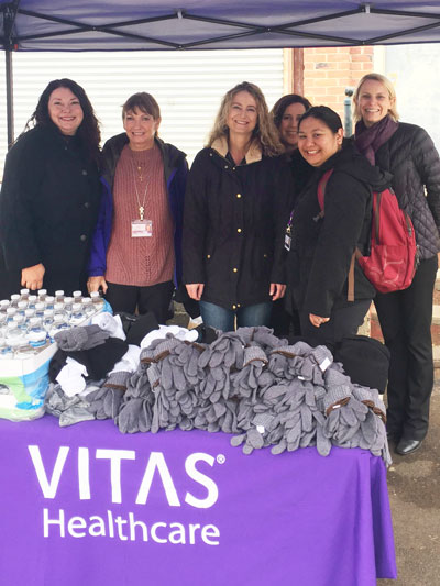 VITAS team members Nancy Cordova, Pamela Mello Dennis,Amy Harris, Janine Siegel, Kristin Antonio and Lena Nilsson with gloves, hats, socks and water bottles