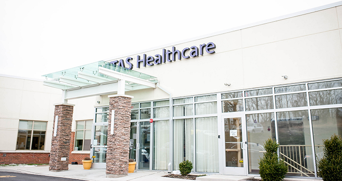 The exterior front doors of the new location