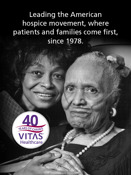 A caregiver with a hospice patient who uses oxygen tubes