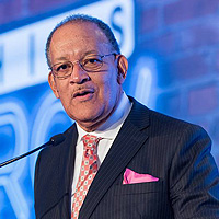 Dr. Richard Payne speaks at a conference
