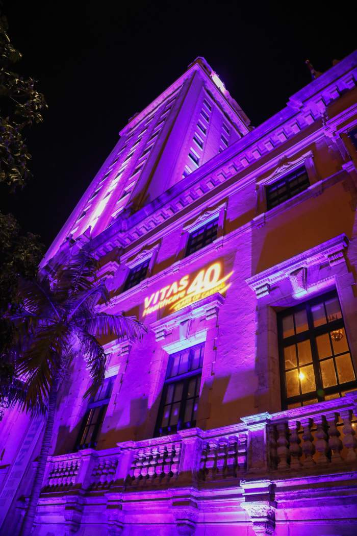 The tower is bathed in purple light, with the VITAS logo, to honor VITAS' 40th anniversary
