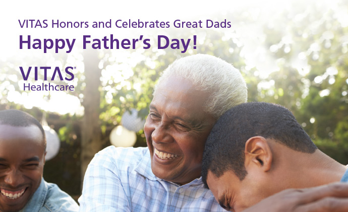 A father smiles with his sons, with a caption reading "VITAS honors and celebrates great dads, Happy Father's Day!"