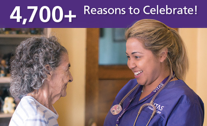 A VITAS nurse smiles with a patient