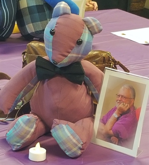 One of the Memory Bears sewn by a Chicago volunteer with a photo of a loved one in whose memory it was made