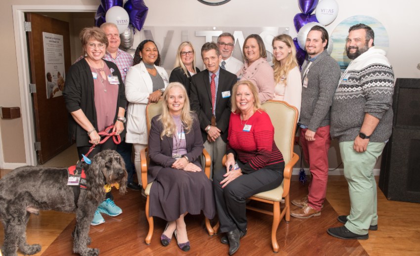 The VITAS Treasure Coast team poses for a photo with a Paw Pals dog