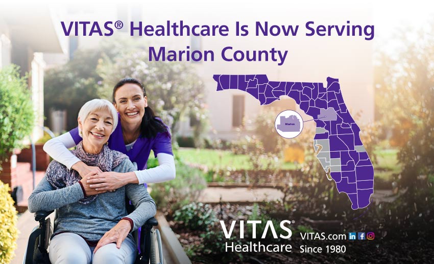 VITAS Healthcare is now serving Marion County Florida with a map of Florida counties and a nurse embracing a patient in a wheelchair
