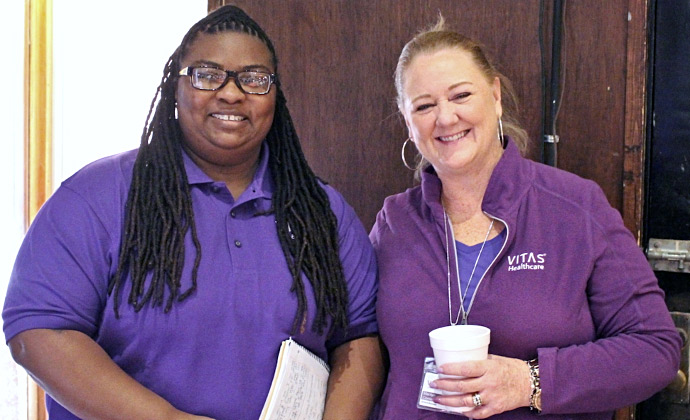 Two VITAS employees in Dallas smile together