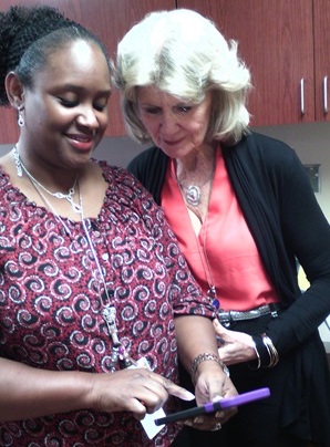 Judy helping another co-worker