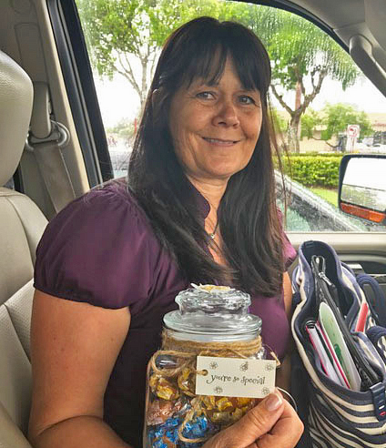 Debbie holding treats before visit with doctor's office