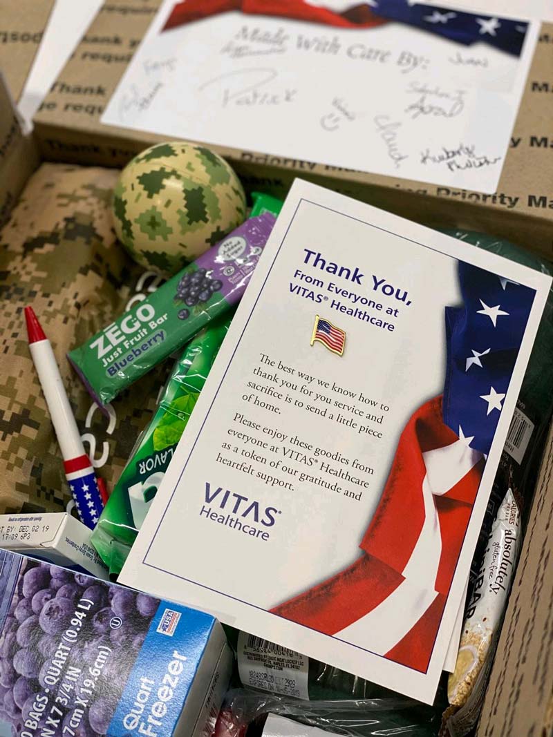 A card with a message of support and a flag lapel pin went into each care package