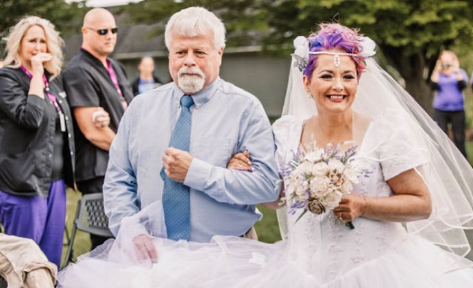 BJ and her uncle walk down the aisle