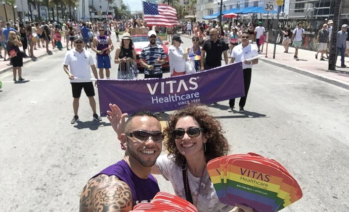 VITAS team members Jaime Collazo and Nancy Auster and other teammates represent the company at a Pride parade