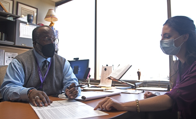 VITAS bereavement manager and chaplain Mark Hensley talks with a colleague in Columbus