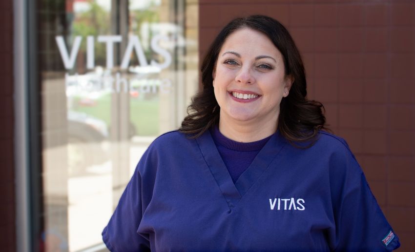 Ashlee Warren smiles at the VITAS office