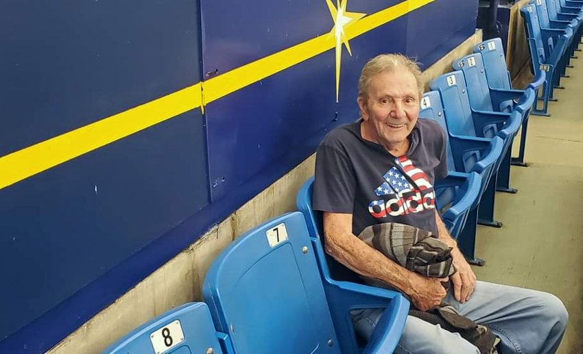 VITAS patient Frank Vela gets ready for the game in his seat at the ballpark