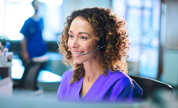 A VITAS customer service representative answers a telephone call