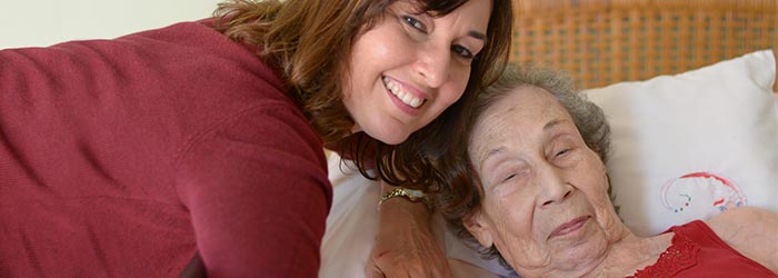 VITAS social worker Johanna Marquez with a patient