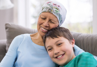 A woman smiles with her mother