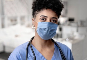 A nurse wearing a mask