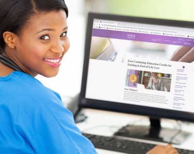 A healthcare professional views VITAS webinars on her computer screen