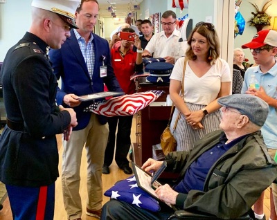A VITAS patient with his family at a flag-folding ceremony