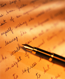 Pen on paper with writing on it