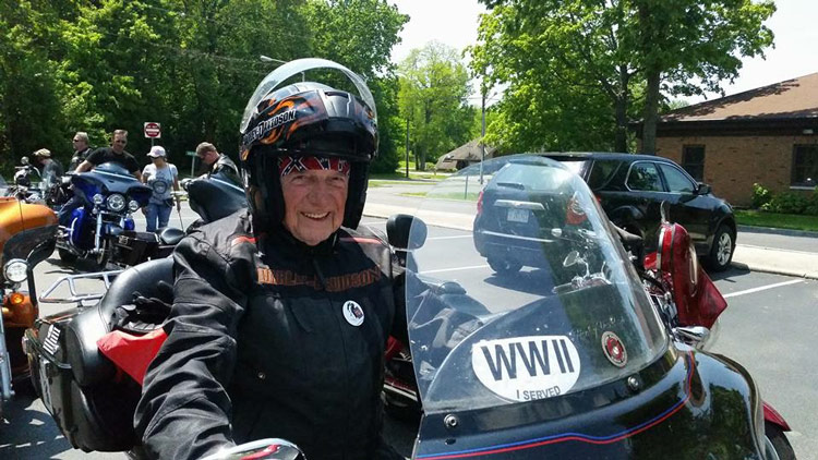Dr. E. Bruce Heilman arriving on motorcycle