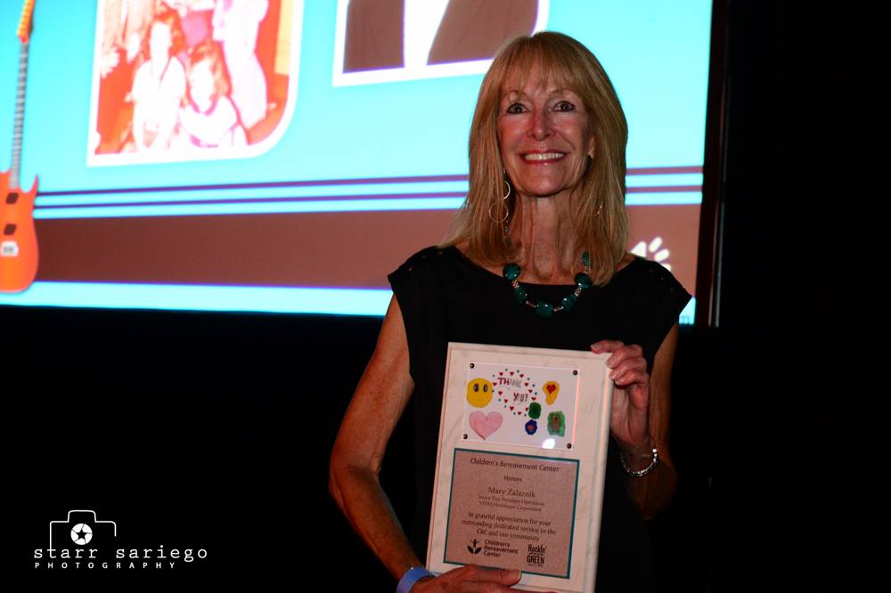 Mary Zalaznik smiling with her award