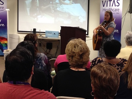 VITAS employee playing the guitar
