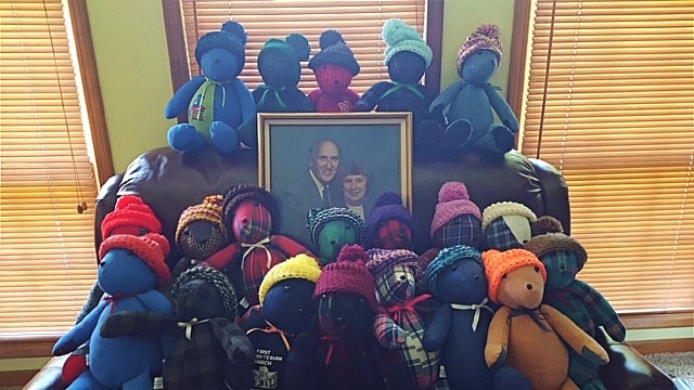 Memory Bears sewn for the Prosser family surround of photo of Henry and Marian