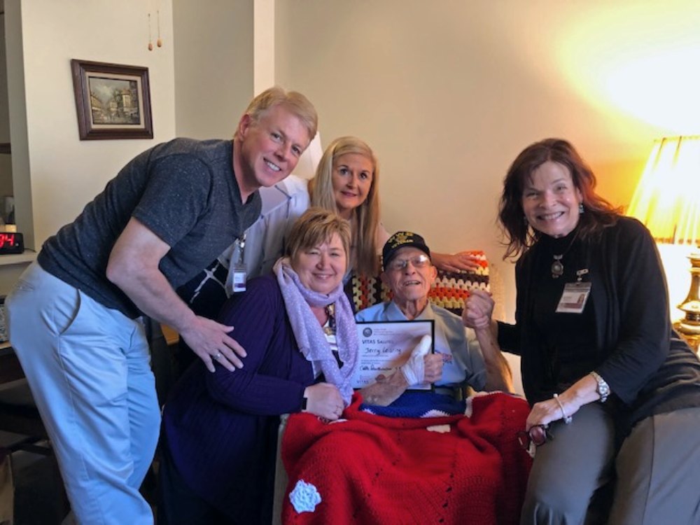 Jerry Leisring is presented with the blanket during a bedside salute