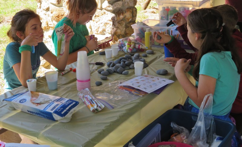 A small group does arts and crafts at a table