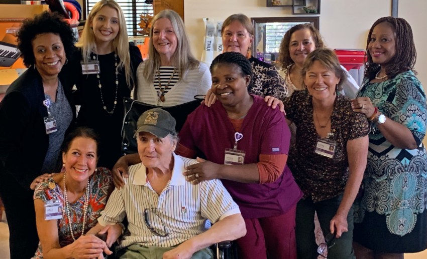 David smiles with members of his VITAS hospice care team