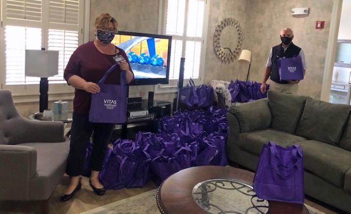 VITAS Admission Liaison Carole Quackenbush and VITAS Representative Eric Grombala show some of the goodie bags they filled