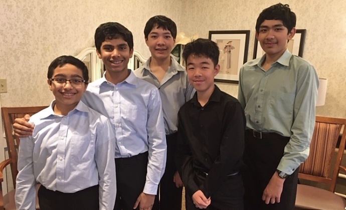 The musicians of Satulem Instrumentals pose for a photo at a Plano nursing home