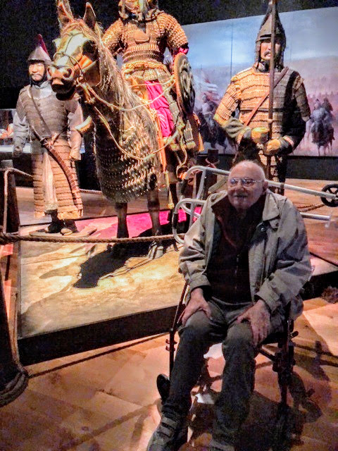 Warner Bergh in front of an exhibit showing Mongol armor