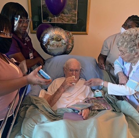 With his wife and care team at his bedside, Reese kisses an angel statue he received as a gift