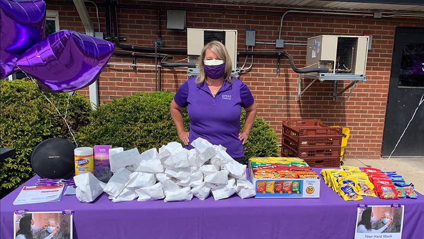 Mary with her table of snacks and other goodies